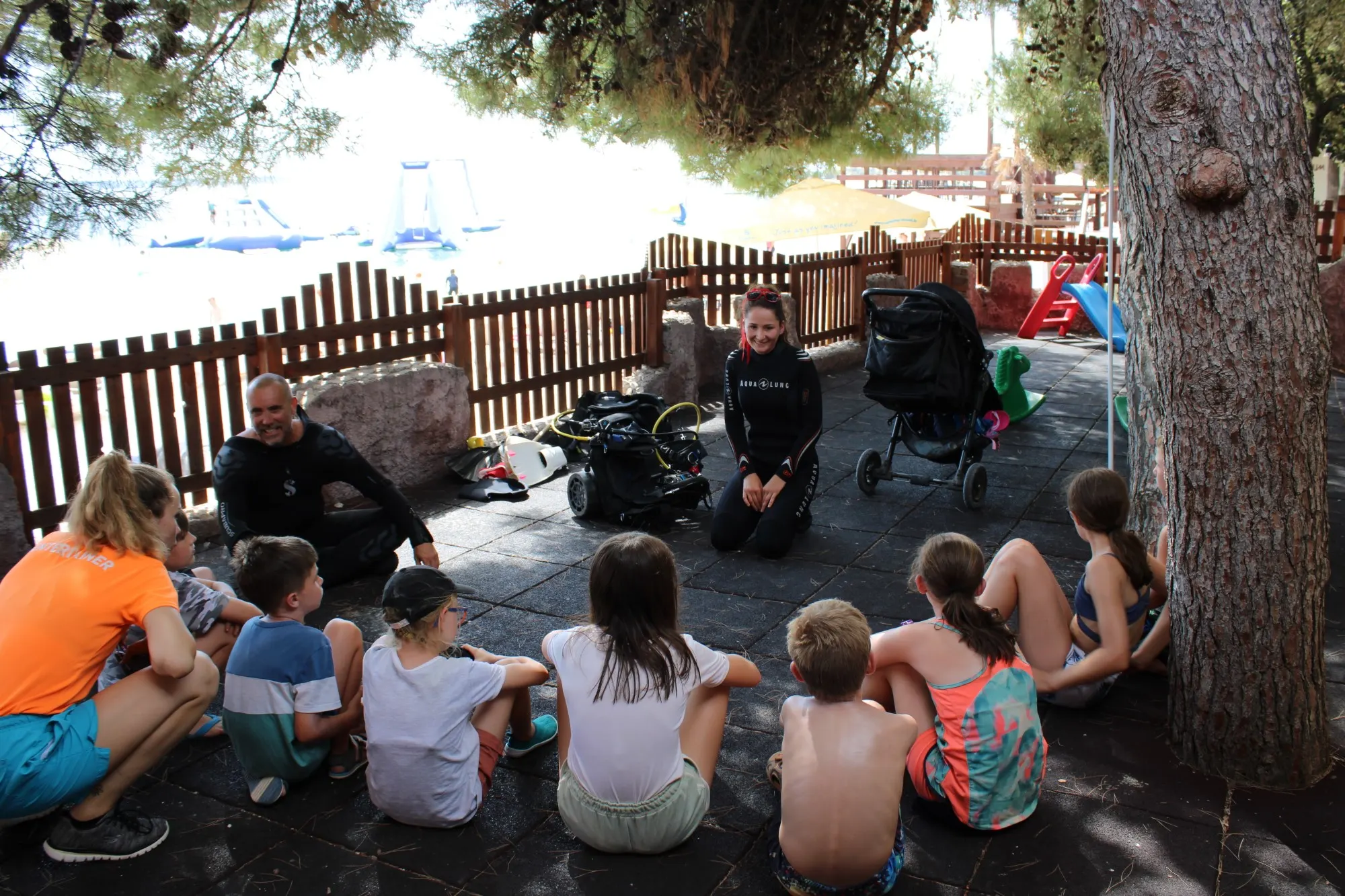 Child learning to dive with a Foka instructor on Pag